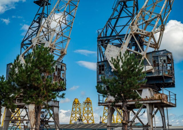 Leith Dockyard old cranes and Wind turbine bases waiting to be transported