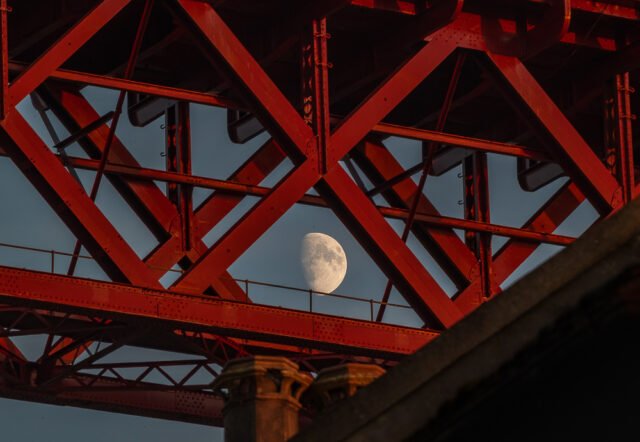 Cold moon appears between the girders North Queensferry